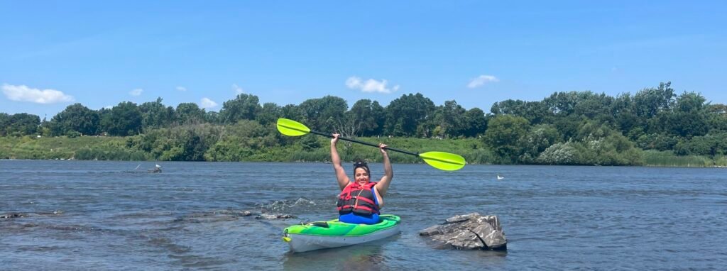 person kayaking on a river